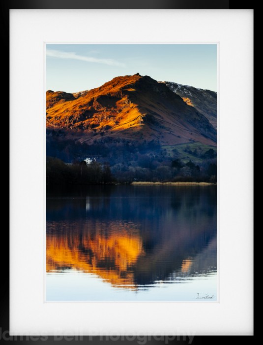 Helm Crag reflecting in Grasmere.
